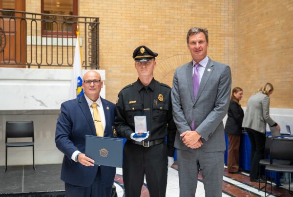 WCSO Officer Nicolas Wojnar accepts the MSA Correctional Officer of the Year award, presented by Hampden County Sheriff Nick Cocchi, and accompanied by Worcester County Sheriff Lew Evangelidis